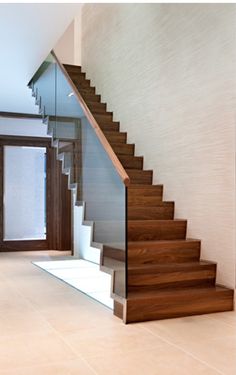 Walnut and glass stairs Glass stairs, Decor and Ideas - @Azu Le And Company Glass Railing Stairs, Staircase Railing Design, Glass Stairs, Stair Railing Design, Glass Staircase, Stairs Design Modern, Floating Stairs