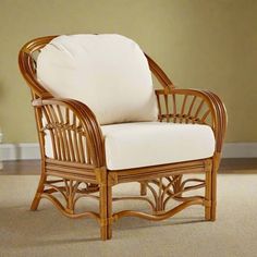 a wicker chair sitting on top of a carpeted floor