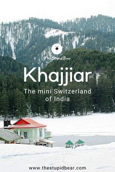 the mountains are covered in snow and there is an advertisement for khajjar