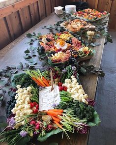 a long table filled with lots of different types of food on it's sides