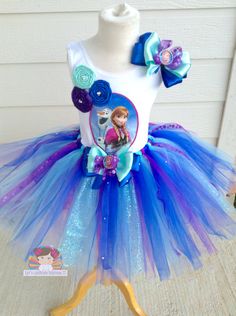 a dress made to look like a frozen princess with blue, purple and white tulle