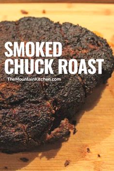 a close up of a piece of food on a cutting board with the words smoked chuck roast