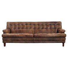 a brown leather couch sitting on top of a white background