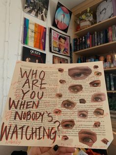 a person holding up a sign that says who are you when nobody's watching?