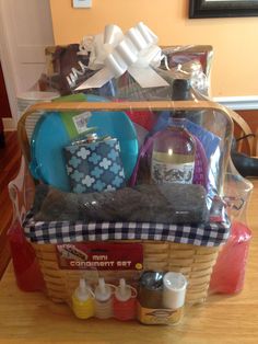 a basket filled with lots of items on top of a counter next to a mirror