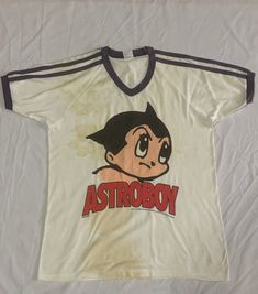 TSHIRT Used Item Manual Measurements : "inch Armpit : neck seam to bottom : shoulder : sleeve : Good Conditions 8/10 have a stains around the tees Accepted. Paypal All Items No Refund Worlwide Shipping *shipping method *ship the next day after payment completed. * Pay above $85 shipped via dhl express. *custom duty and tax we will declare low value prices as a gift. *please drop your phone number after purchased. *we provide with tracking number. 80s Streetwear, Y2k Graphic Tees, Boy Vintage, 90s Tshirt, Boys Fits, High Fashion Outfits, 90s Shirts, Astro Boy, Boys Graphic Tee