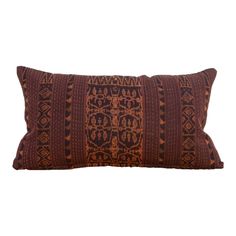 a brown and black pillow on a white background