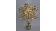 a lighted snowflake on a stand with lights in the shape of a christmas tree