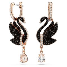 These light-catching earrings are a beautiful expression of the signature Swarovski emblem. Connected to mini hoops, each rose gold-tone plated piece features an elegant swan motif, expertly decorated with a pavé of jet black Swarovski ReCreated™ crystals. A clear, pear-cut Swarovski Zirconia delicately hangs beneath from a rose gold-tone link. Wear these earrings to elevate your own style, or present them as a radiant gift to a loved one. Baking Conversions, Flowers For Men, Artistic Earrings, Swarovski Swan, Outfit Pieces, Swarovski Earrings, Swarovski Jewelry, Black Earrings, Accessories Jewelry Earrings