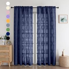 a living room with blue curtains and various colors on the window sill, in front of a white wall