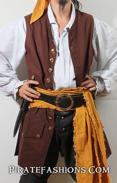 a man dressed in pirate clothing with his hands on his hips