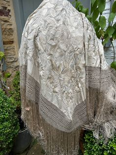 A stunning spectacular large shawl which I believe dates circa 1910-20s  Made from a super ivory cream silk, it features beautifully detailed opulent embroidered floral designs and a knotted fringe all handmade In stunning good commensurate condition. Covered in expertly worked hand embroidery. Made in Canton China by an extremely skilled embroiderer around 1910/20 these beautiful shawls were popular with fashionable European woman.  Measurements:   Shawl 62" - 160cms Fringe aprox 15" - 38cms A Manila, Canton China, Knotted Fringe, European Women, Cream Silk, Ivory Silk, Silk Shawl, Shawls And Wraps, Vintage Wedding