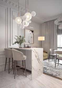 an elegant dining room with marble countertops and white chairs in front of a chandelier