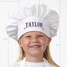 a young boy wearing a chef's hat with the word junior chef written on it