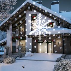 a house is decorated with christmas lights and snowflakes