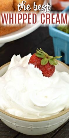 whipped cream in a bowl with strawberries on top and the text overlay reads, how to make the best whipped cream