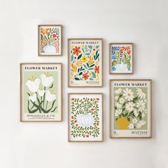 four framed flower market posters hanging on the wall