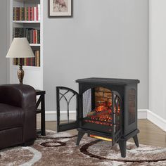 a living room with a fire place in the center and a chair next to it