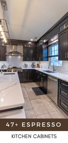 a kitchen with dark cabinets and white counter tops is featured in the article, 47 + espresso kitchen cabinets