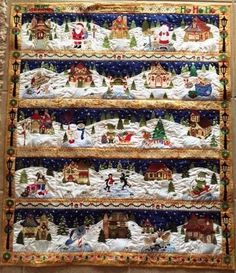 a christmas quilt hanging on the wall