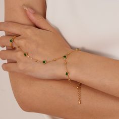 ✦ Unleash your colorful and playful side with our Evil Eye Pearl Slave Ring Hand Chain Bracelet! This bohemian-inspired piece features a butterfly and lucky clover leaf with pearl beads, perfect for any beach party or formal occasion. The adjustable open cuff ensures a perfect fit, while the gold-plated stainless steel is hypoallergenic. Get ready to rock this Y2K feel all summer long! ----------- DETAILS ----------- - Color: Gold - Pattern: Style 1- Style 8 - Size: Please refer to the parameter of each ring chain bracelet - Ring Size: Open & Adjustable - Materials: Gold Plated, Surgical Steel, Cubic Zirconia, Glass, Enamel *Stainless Steel is hypoallergenic, generally safe for sensitive skin. - SKU: TYB006 Bracelet Attached To Ring, Ring With Bracelet Attached, Hand Chain Bracelet, Ring Bracelet Chain, Heart Shaped Rings, Hand Chain, Lucky Clover, Ring Pendant Necklace, Gold Pattern