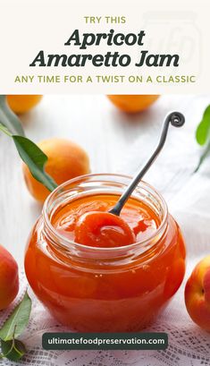 an orange jam in a glass jar with a black stick sticking out of the top