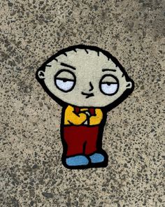 a drawing of a cartoon character is shown on the ground, with blue eyes and red pants