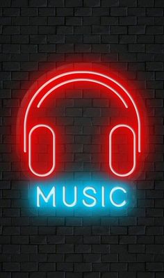 a neon sign that says music with headphones on it in front of a brick wall