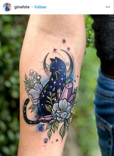 a woman's leg with a cat and flowers tattoo on her left calf sleeve