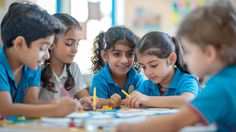 several children sitting at a table with pencils in their hands