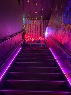 the stairs are lit up with neon lights