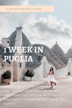 a woman walking down the street in front of some houses with text that reads, i week in pugliia