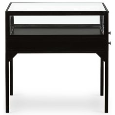 a black table with a glass top and metal frame on the bottom, against a white background