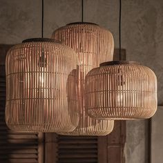 three hanging lights made out of wickers in a living room or dining room