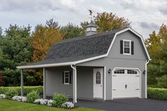 a two car garage with an attached porch