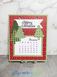 a christmas card with a calendar on it