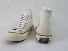 "Vintage 1960s or 70s Converse Chuck Taylors, Chucks hi top basketball shoes. The classic shoe. Made of white canvas. Originally had red laces(included), but I replaced with new vintage white laces. Heel label reads: Converse All Star Chuck Taylor Made in U.S.A. Size 11. Actual measurements are: 12.5\" toe to heel across the soles 4\" across the soles widest point (ball of the foot) In very good condition with some dye from the red laces on the tongue." Chuck Taylors Converse, 1970s Shoes, 70s Converse, Converse Chuck Taylor 70, Converse Vintage, Charlie Spring, Chuck Taylor 70, Converse Hi, Pf Flyers