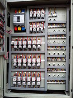 an electrical panel with many different types of wires and switches on it's sides