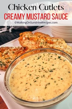 chicken cutlets with creamy mustard sauce in a glass bowl on a white plate