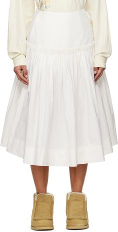 Organic cotton poplin skirt. Gathering throughout. · Button fastening at front · Hand-embroidered logo at hem · Corozo nut hardware Supplier color: Ecru Cream Cotton Relaxed Skirt, Cream Long Skirt With Gathered Detail, Cream Midi Lined Skirt, Cream Gathered Midi Skirt, Skirt Gathering, Cream Flowy Midi-length Skirt, Story Mfg, Poplin Skirt, Front Hand