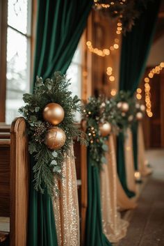 christmas decorations on the banisters in front of green drapes and gold ornaments