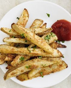 french fries with ketchup on a white plate