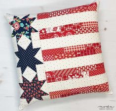 an american flag pillow with stars and stripes