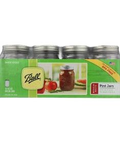 six jars of pickle with apples in them