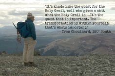 a man standing on top of a mountain with a backpack