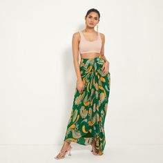 Green Paisley Draped Skirt | Style Junkiie | Wolf & Badger Fitted Paisley Print Skirt For Summer, Fitted Pre-draped Skirt For Summer, Fitted Draped Bottoms For Summer, Summer Draped Flowy Skirt, Green Fitted Asymmetrical Draped Skirt, Summer Draped Wrap Skirt, Fitted Green Wrap Skirt For Vacation, Green Paisley Print Bottoms, Summer Party Draped Wrap Skirt