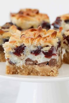 some desserts are on a white plate and ready to be eaten