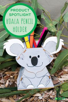 a koala pencil holder with markers in it