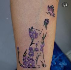 a dog with flowers and butterflies on it's leg