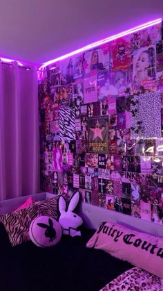 a bedroom with purple lights and pictures on the wall